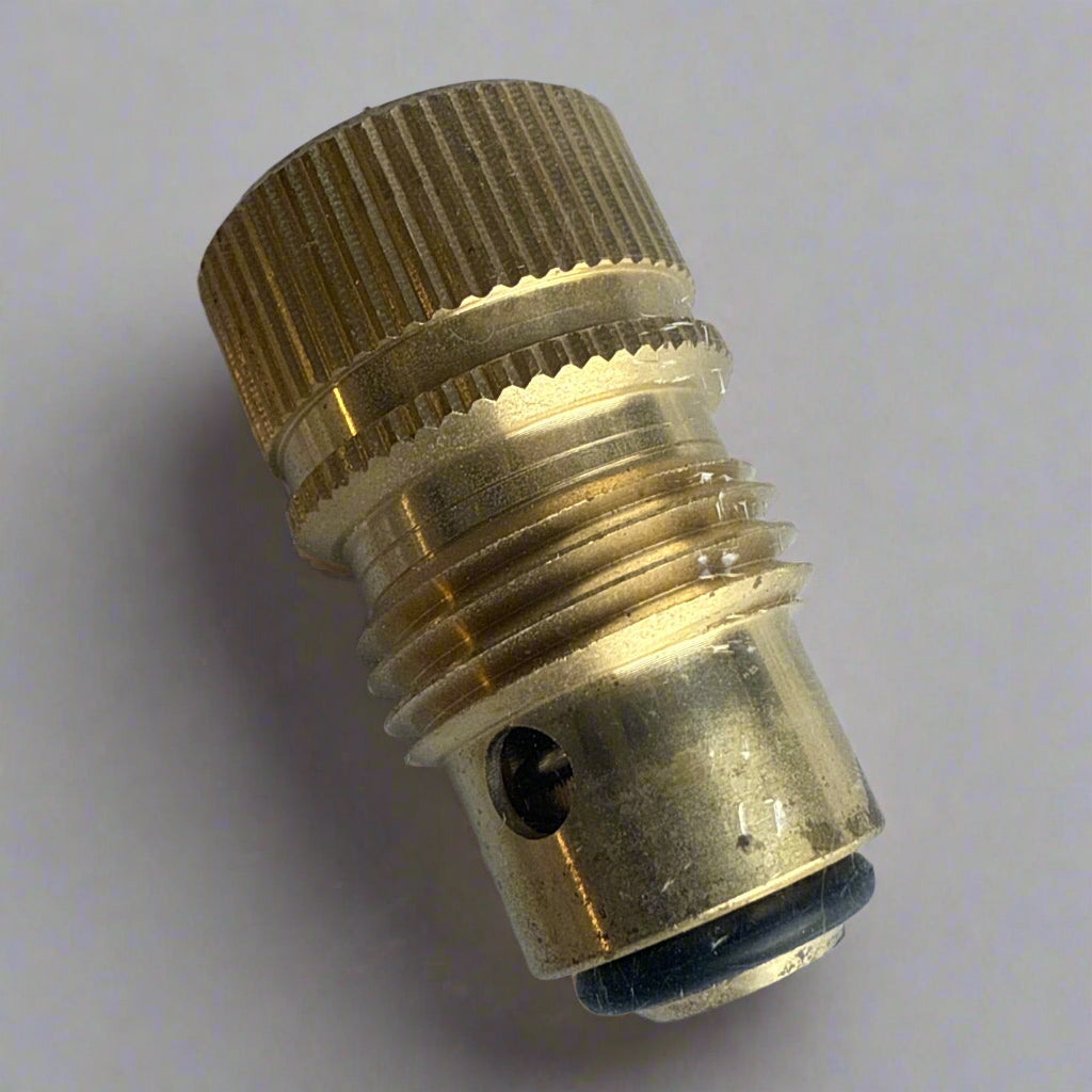 Brass fitting on a clear plastic background